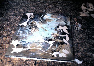 collage pieces added to painting